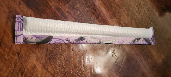 Close-up of vibrant ready to press custom sublimation transfers with a heat press, emphasizing quality and local Houston pickup service for small businesses.