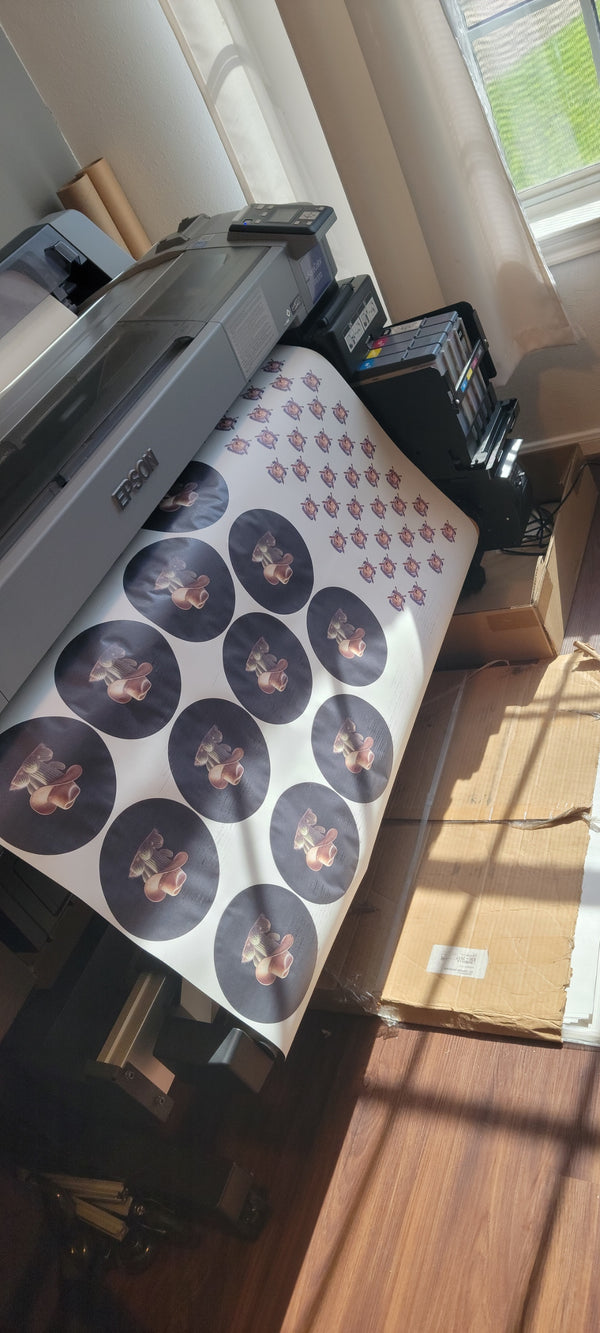 Close-up of vibrant ready to press custom sublimation transfers with a heat press, emphasizing quality and local Houston pickup service for small businesses.