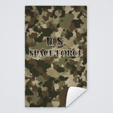 Camo U.S. Space Force rally towel, tan, brown and green camo with U.S. SPACE FORCE, corner folded to show the white back