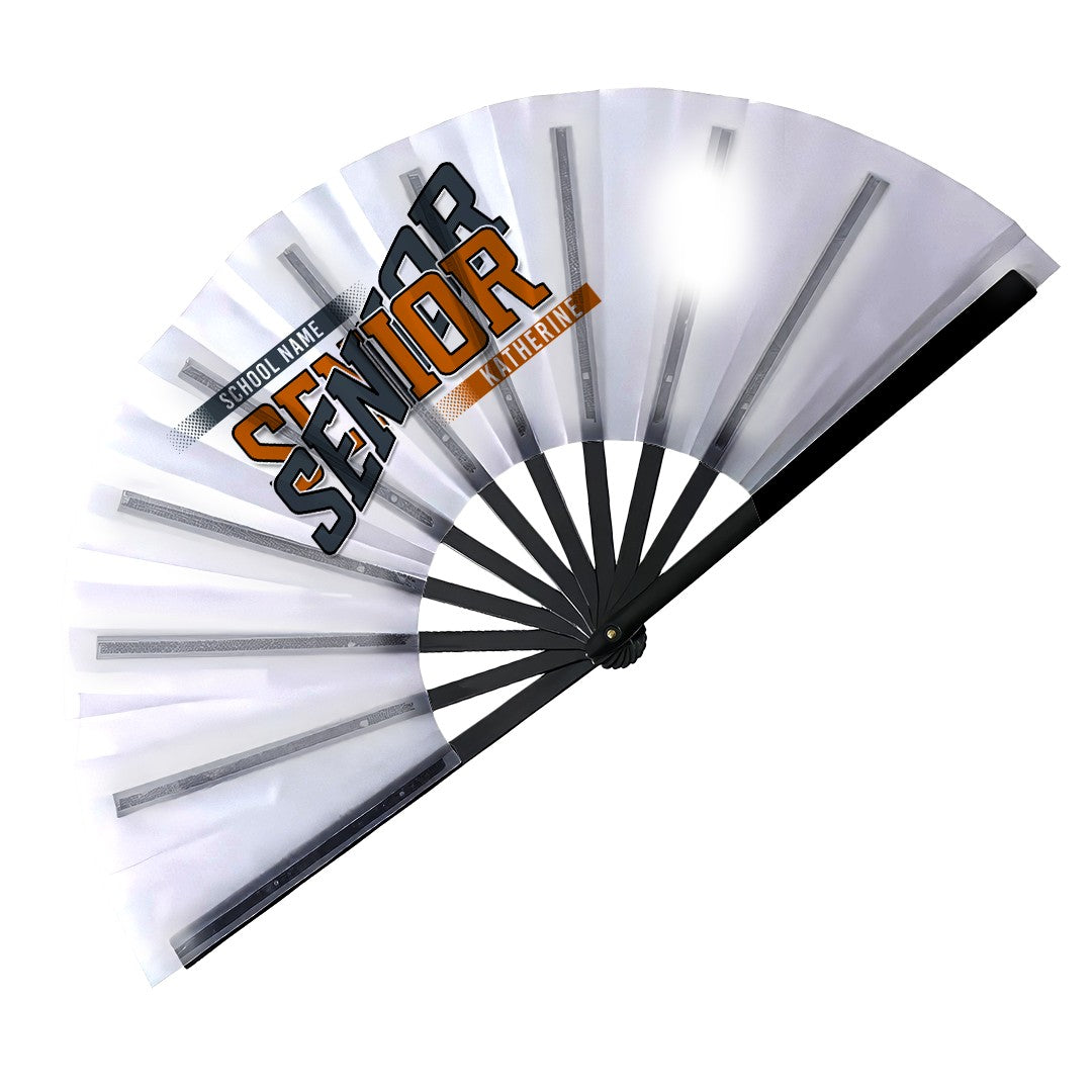 Open class year Senior clack fan with black ribs, school name and student name in burnt orange and charcoal