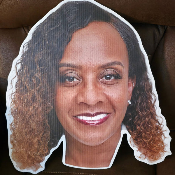 Custom big head cutout of a smiling woman's face, printed in full color on white corrugated plastic and cut to the shape of her head, standard 19 x 20 inch size