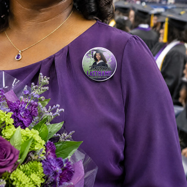 Custom graduation photo pin button worn by a proud mom at a college graduation ceremony