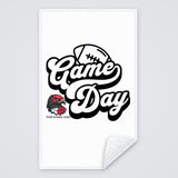 Custom spirit towel with a black and white Game Day football design and a school logo, rally towel with the corner folded to show the white back