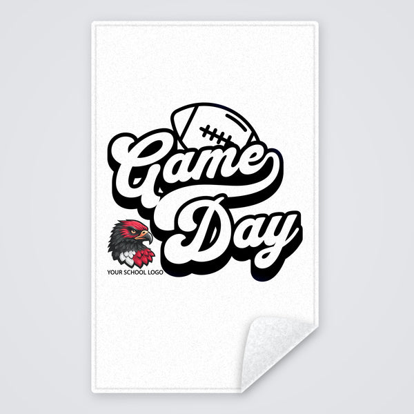 Custom spirit towel with a black and white Game Day football design and a school logo, rally towel with the corner folded to show the white back