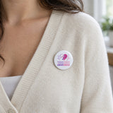 Domestic Violence and Breast Cancer Awareness pin button on a cream cardigan