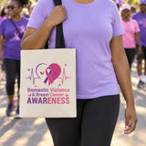 Beige awareness tote bag carried on the shoulder at an outdoor awareness walk