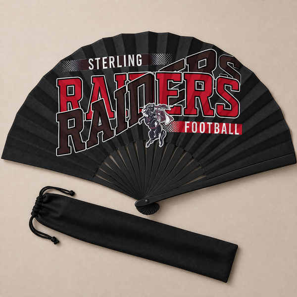 Flat lay of an open black game day clack fan with black ribs and the football team design in red and black, beside its drawstring bag.