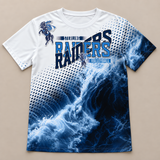 Flat lay of the all over game day spirit shirt, volleyball version, white fading into navy ocean waves with the horse and rider mascot on the shoulder.