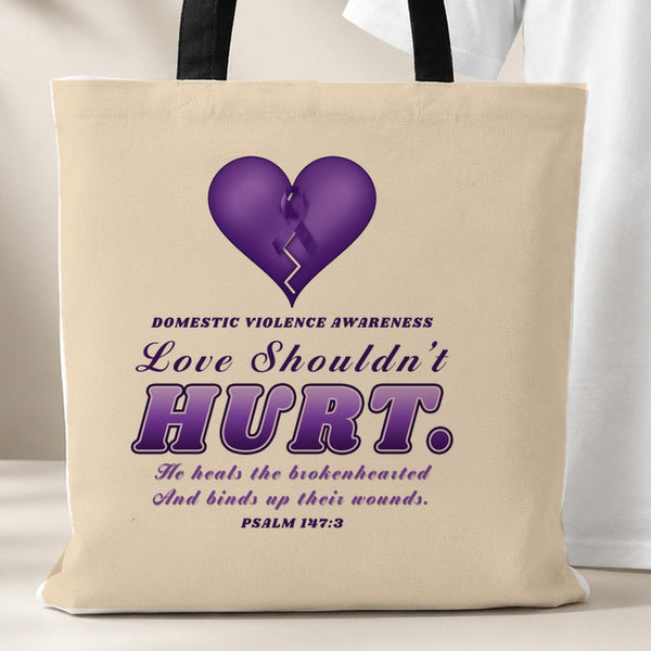 Love Shouldn't Hurt tote bag, beige with black handles, purple heart and Psalm 147:3