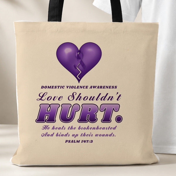 Love Shouldn't Hurt tote bag, beige with black handles, purple heart and Psalm 147:3