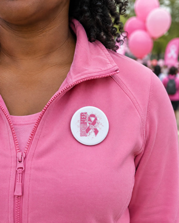 PowHerful in Pink 2.5 inch sublimation button on a pink jacket at an awareness walk