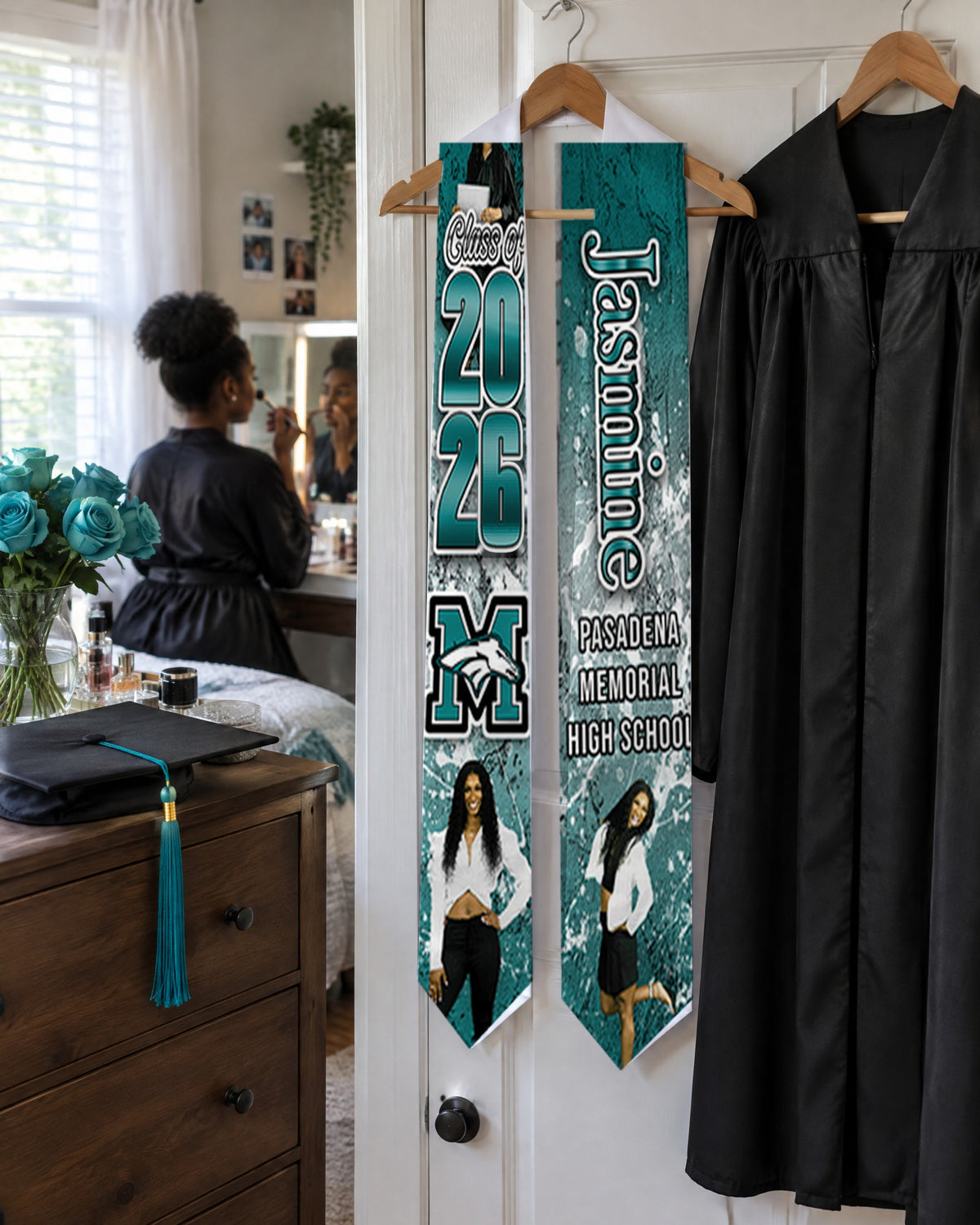 Custom teal graduation stole with Class of 2026, name and photos, hanging on a closet door on graduation morning