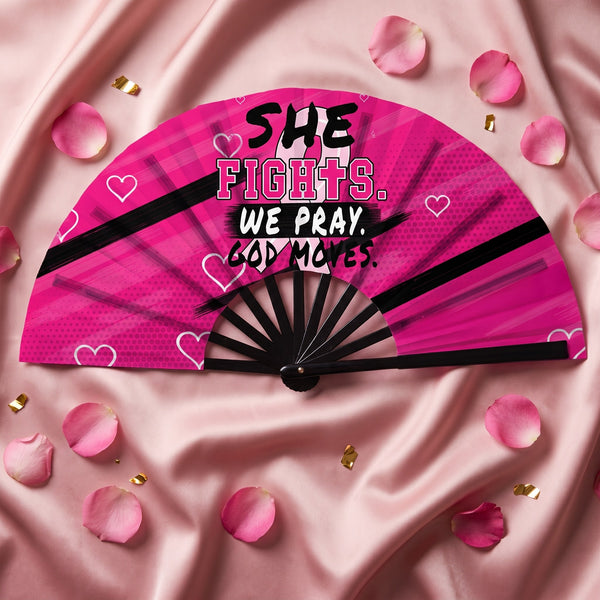 Pink She Fights We Pray God Moves clack fan open on pink satin with rose petals