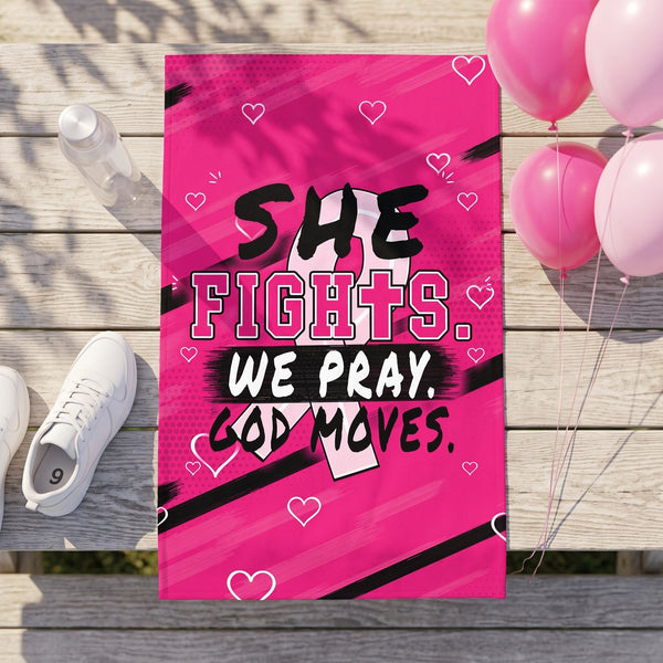 Pink She Fights We Pray God Moves rally towel on a picnic table with sneakers and pink balloons at a breast cancer walk