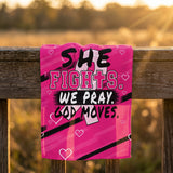 Pink She Fights We Pray God Moves Breast Cancer Awareness rally towel draped on a wooden rail at sunset