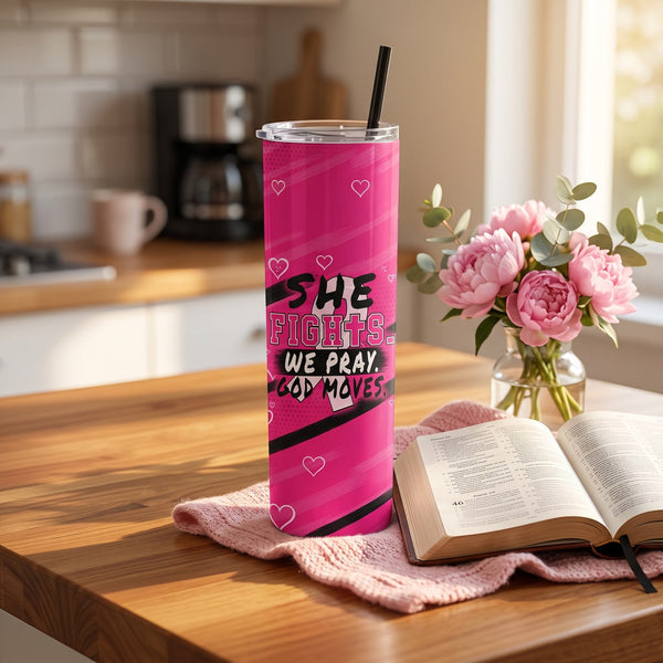 Pink She Fights We Pray God Moves 20 oz tumbler on a kitchen table beside an open Bible and pink flowers