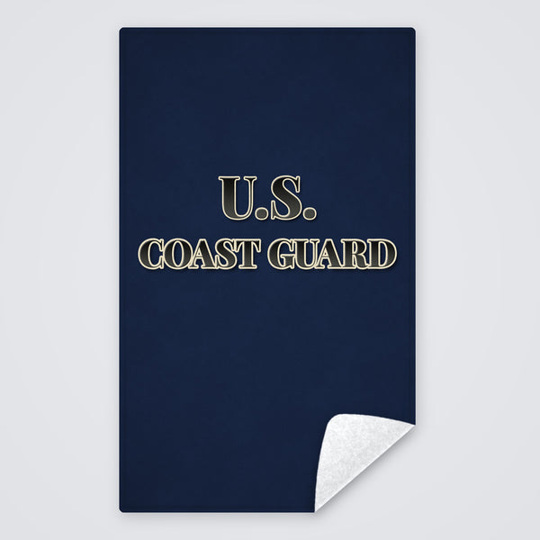 Dark blue U.S. Coast Guard rally towel, solid dark blue with U.S. COAST GUARD, corner folded to show the white back