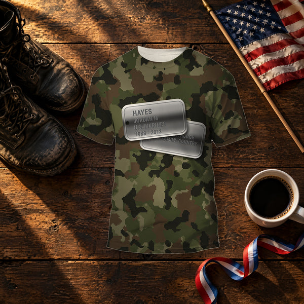 U.S. Marines woodland digital camo Veterans Day shirt with personalized dog tags on the front and U.S. MARINES on the back, folded on a table for a Veterans Day gift